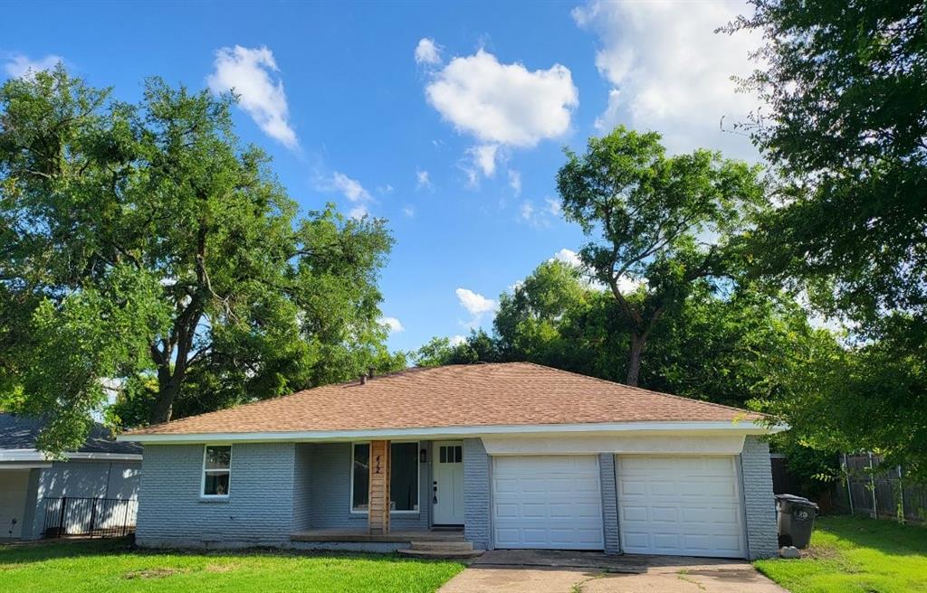 Welcome to your beautiful home with mature trees, covered porch, and large picture window!
