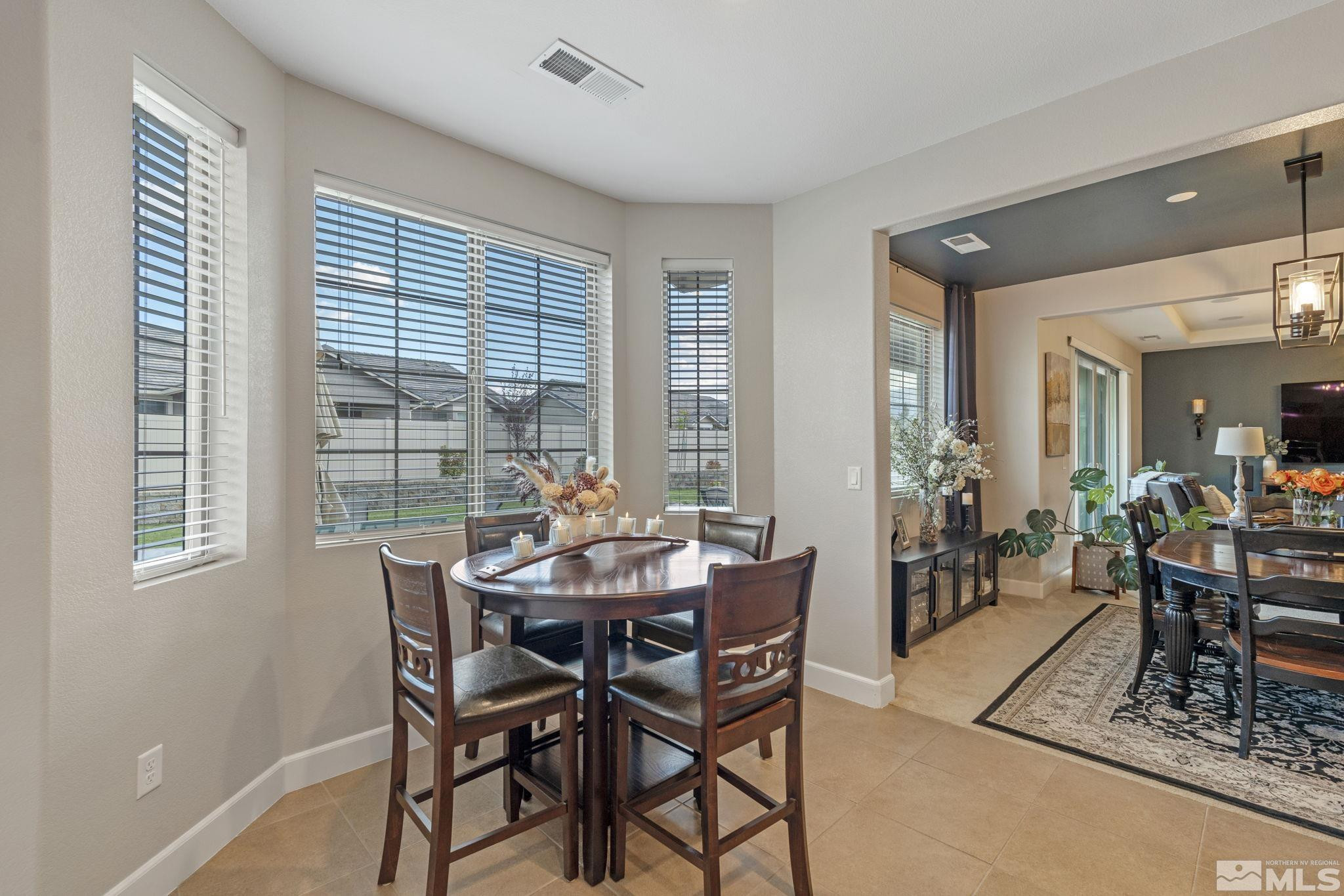 508 Alpine Rose Ct. Reno, NV 89521 - Photo 14 of 39 a view of a dining room with furniture and window