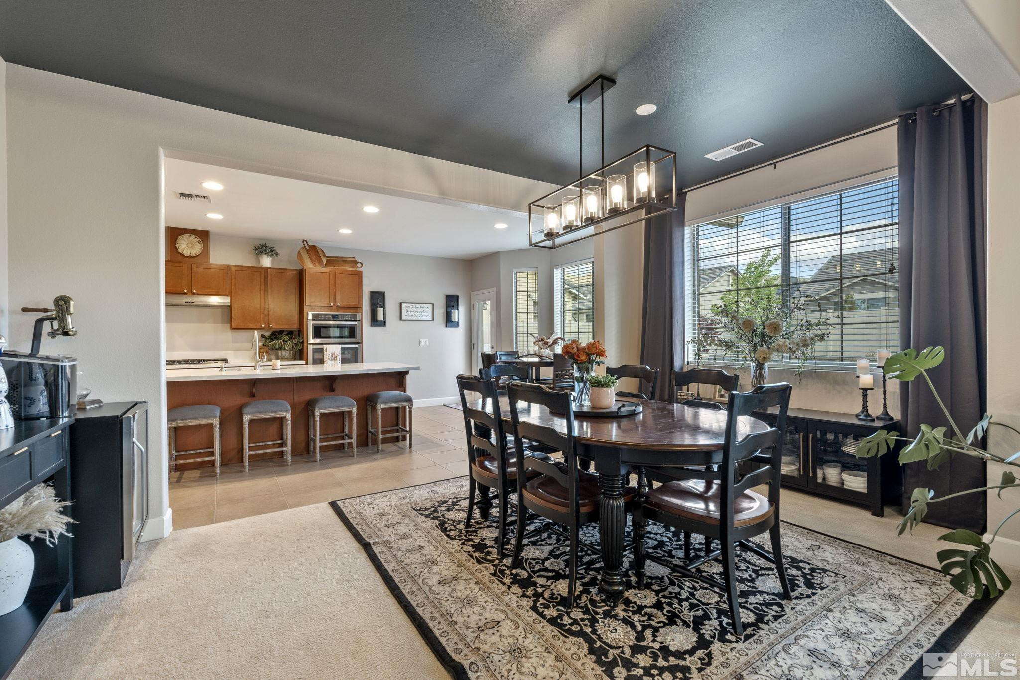 508 Alpine Rose Ct. Reno, NV 89521 - Photo 17 of 39 a view of a dining room with furniture window and outside view