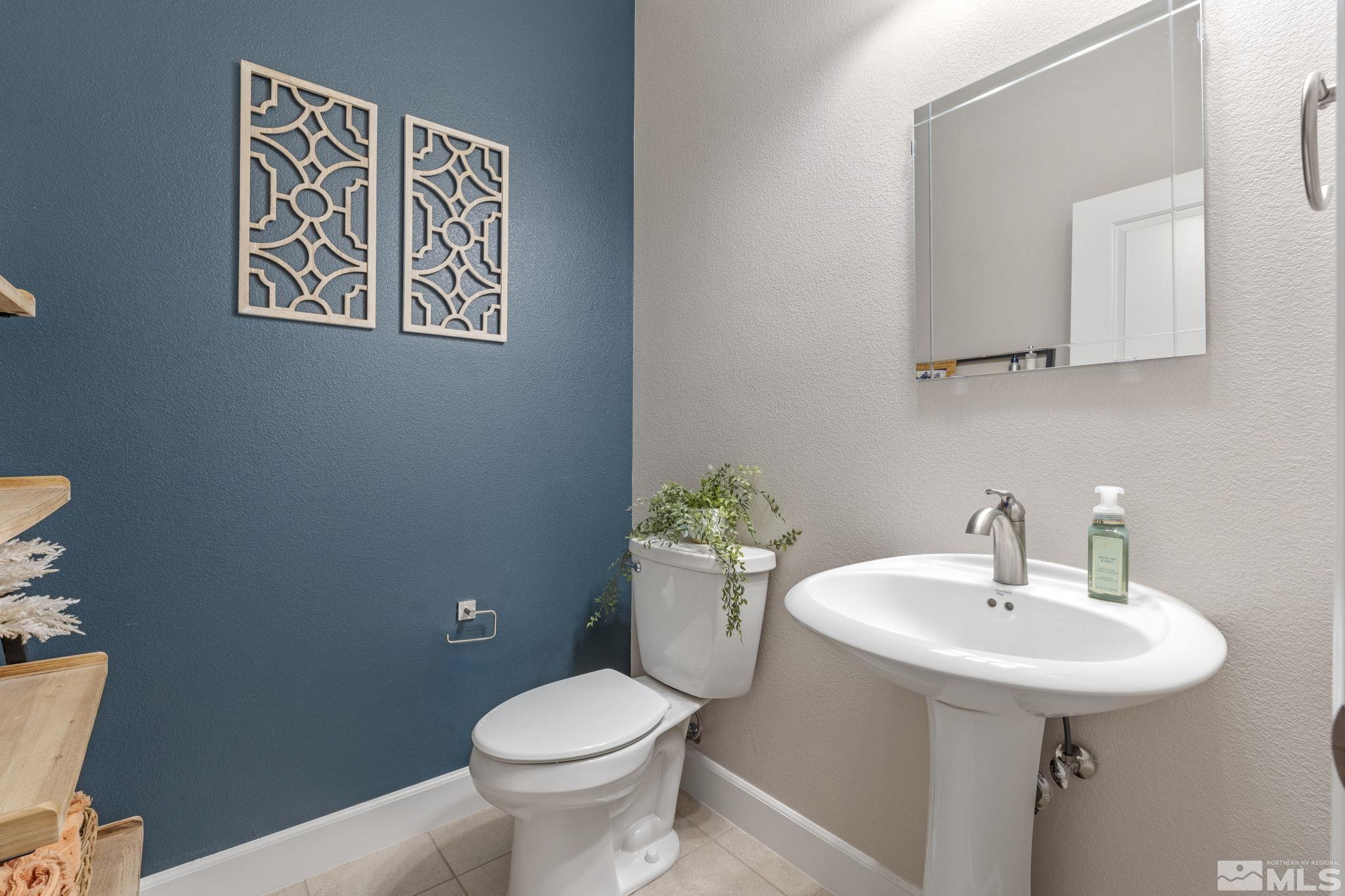 508 Alpine Rose Ct. Reno, NV 89521 - Photo 18 of 39 a bathroom with a toilet sink and mirror