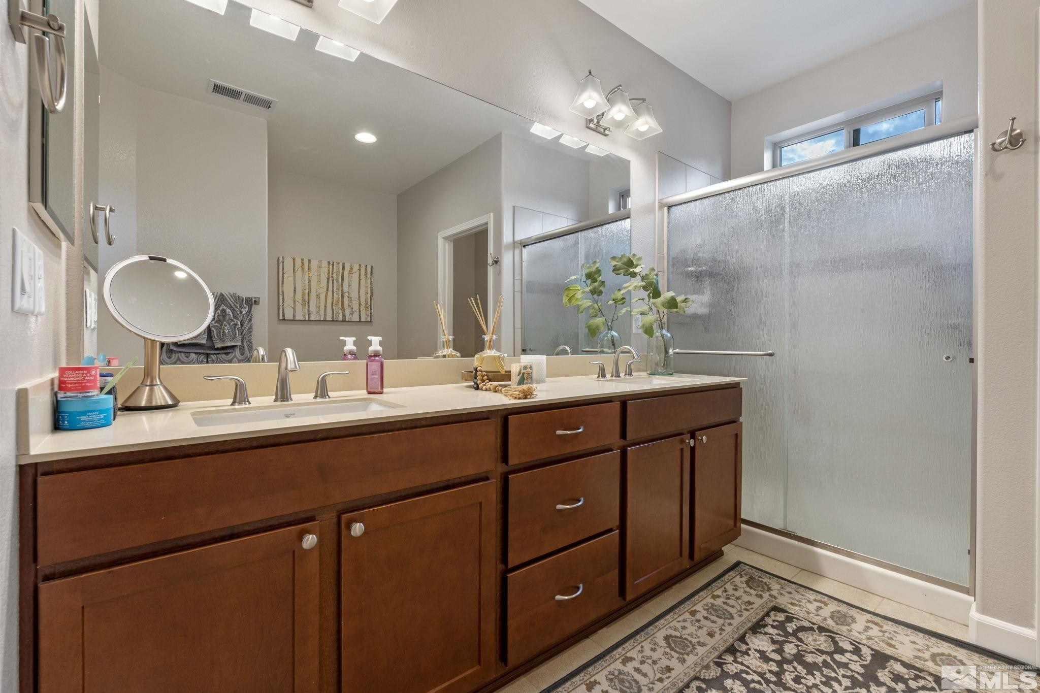 508 Alpine Rose Ct. Reno, NV 89521 - Photo 21 of 39 a bathroom with a double vanity sink and a mirror