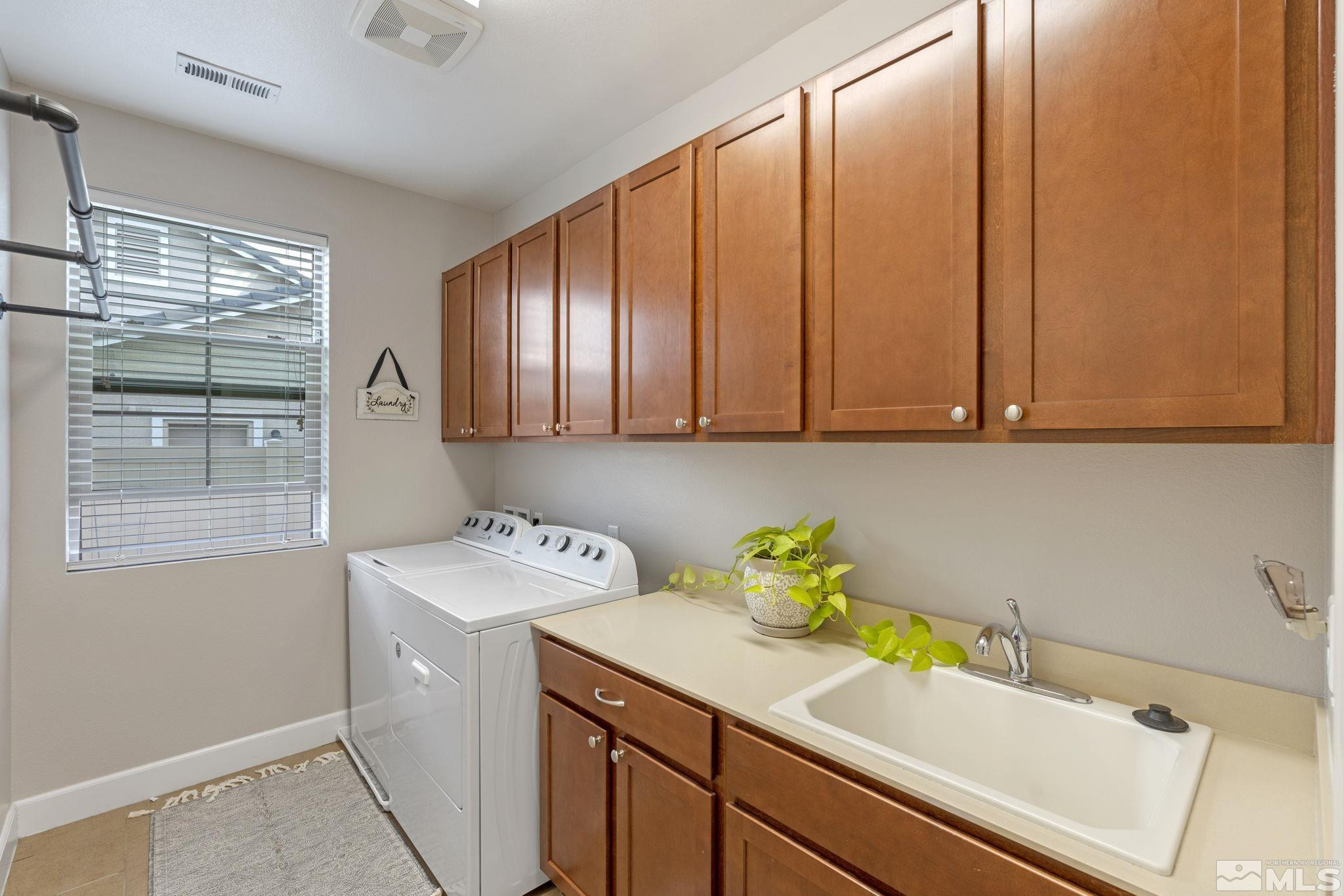 508 Alpine Rose Ct. Reno, NV 89521 - Photo 23 of 39 a utility room with a sink dryer and washer