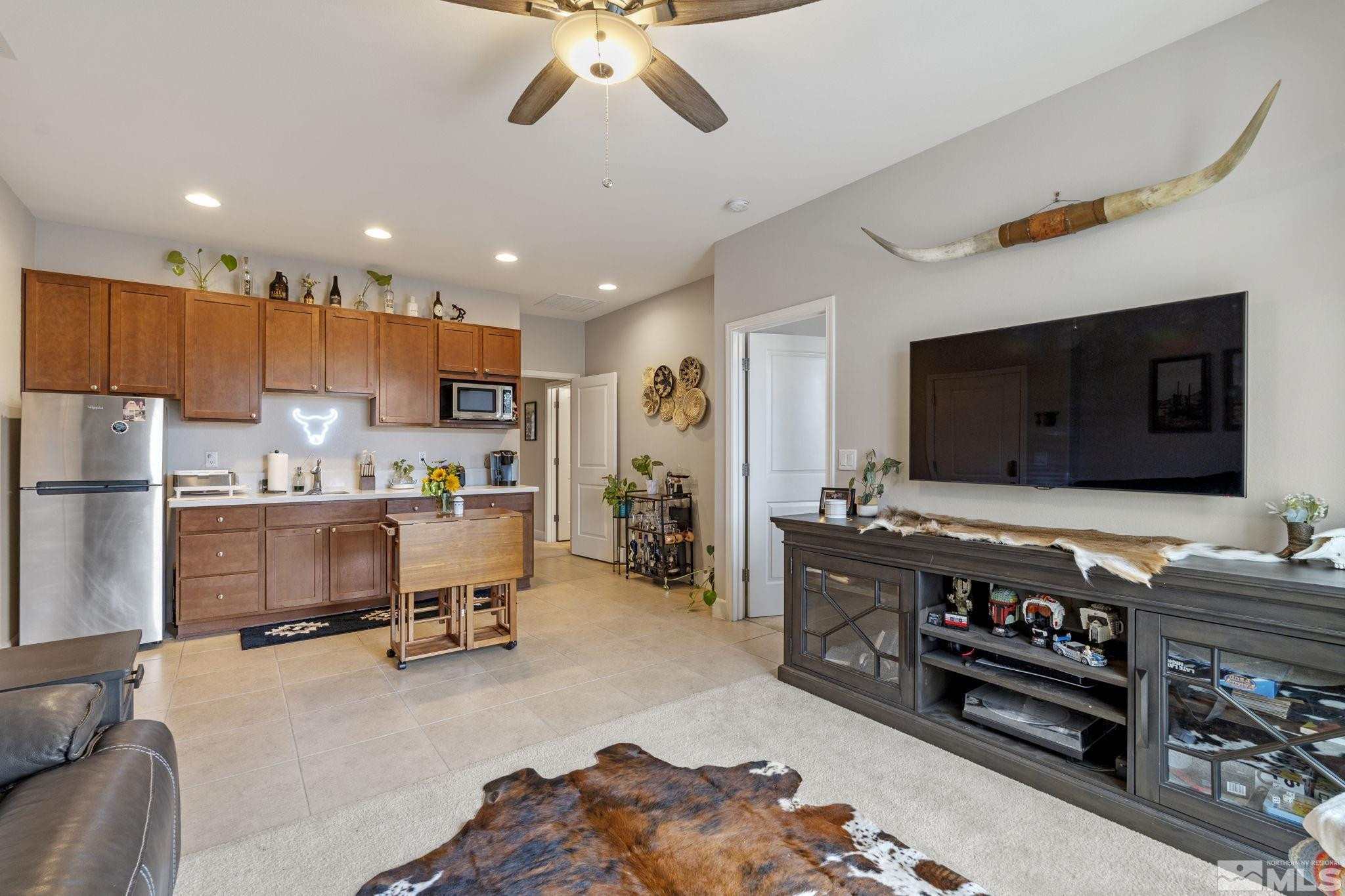 508 Alpine Rose Ct. Reno, NV 89521 - Photo 25 of 39 a living room with furniture and a flat screen tv
