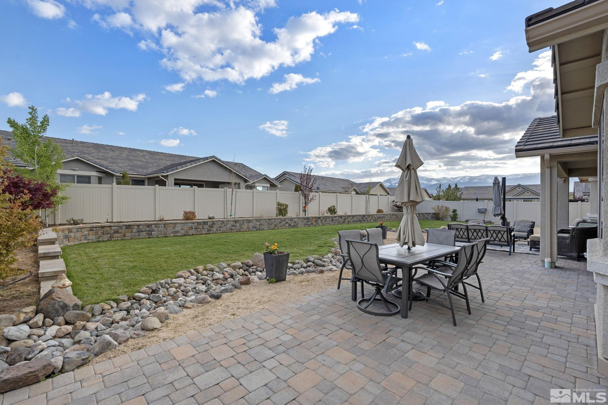 508 Alpine Rose Ct. Reno, NV 89521 - Photo 31 of 39 a view of a patio with a table and chairs
