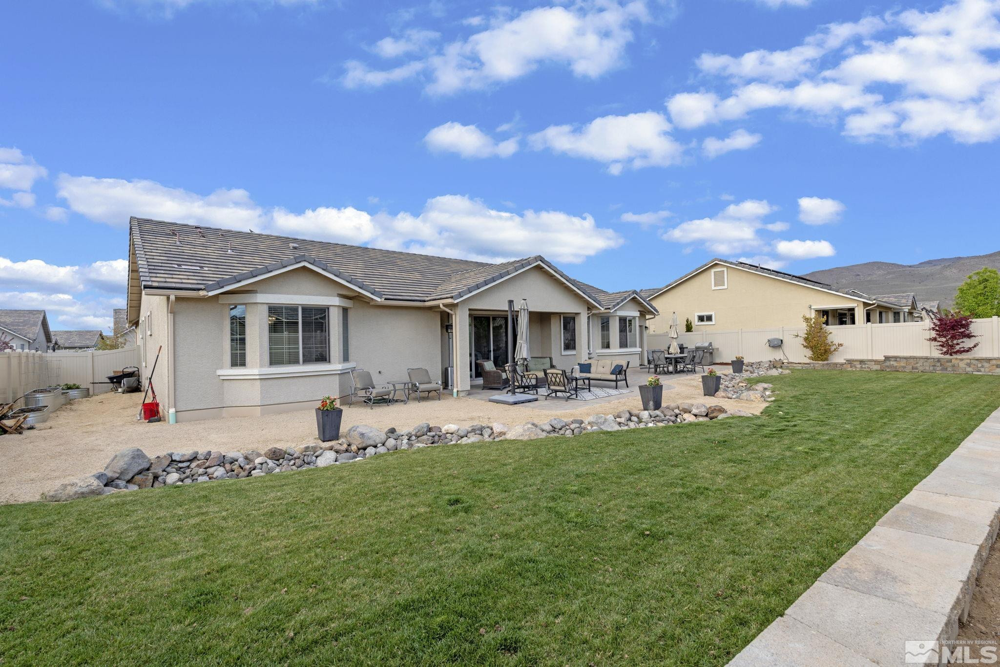 508 Alpine Rose Ct. Reno, NV 89521 - Photo 33 of 39 a front view of a house with a garden and porch