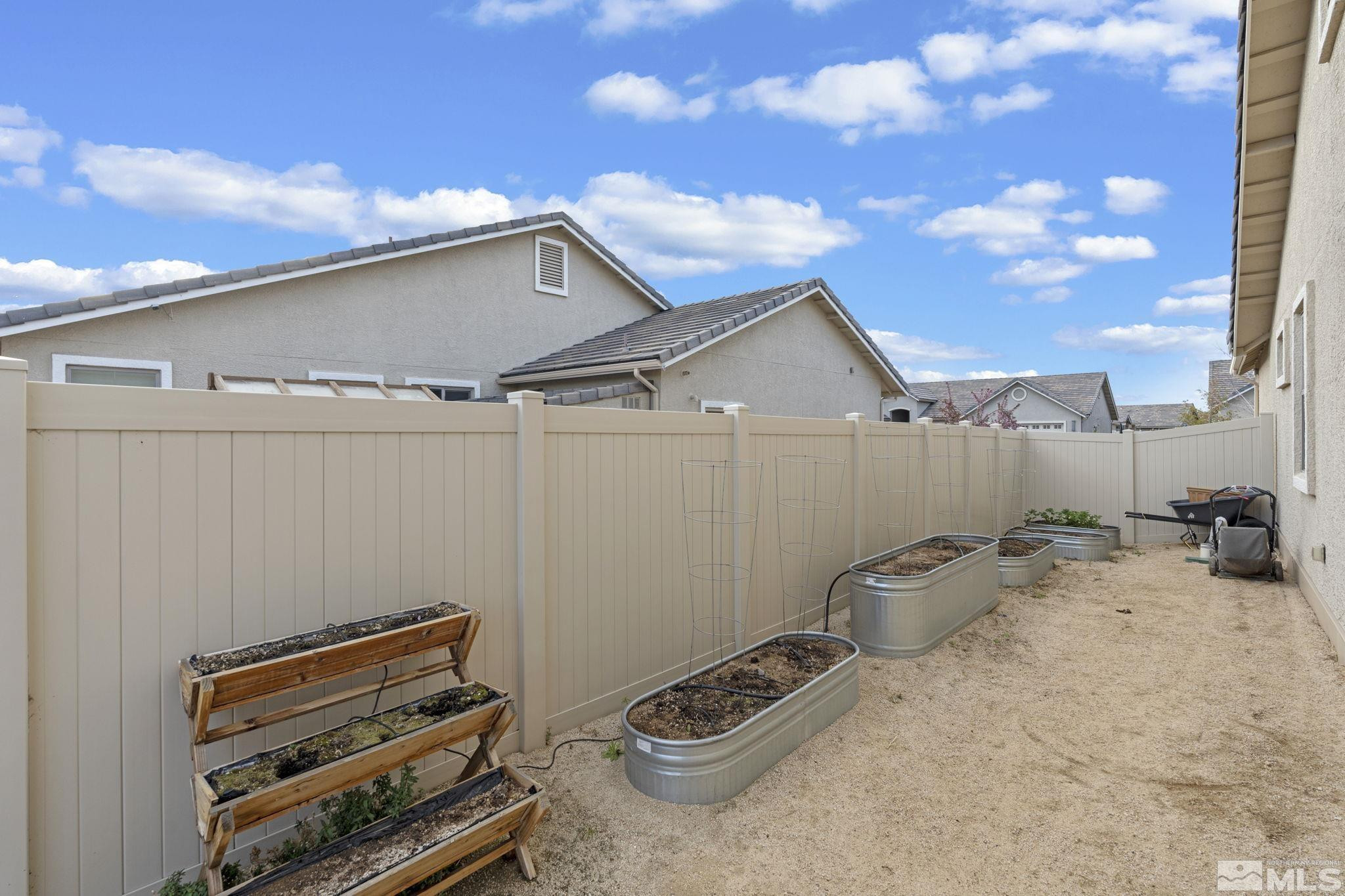 508 Alpine Rose Ct. Reno, NV 89521 - Photo 35 of 39 a backyard of a house with table and chairs