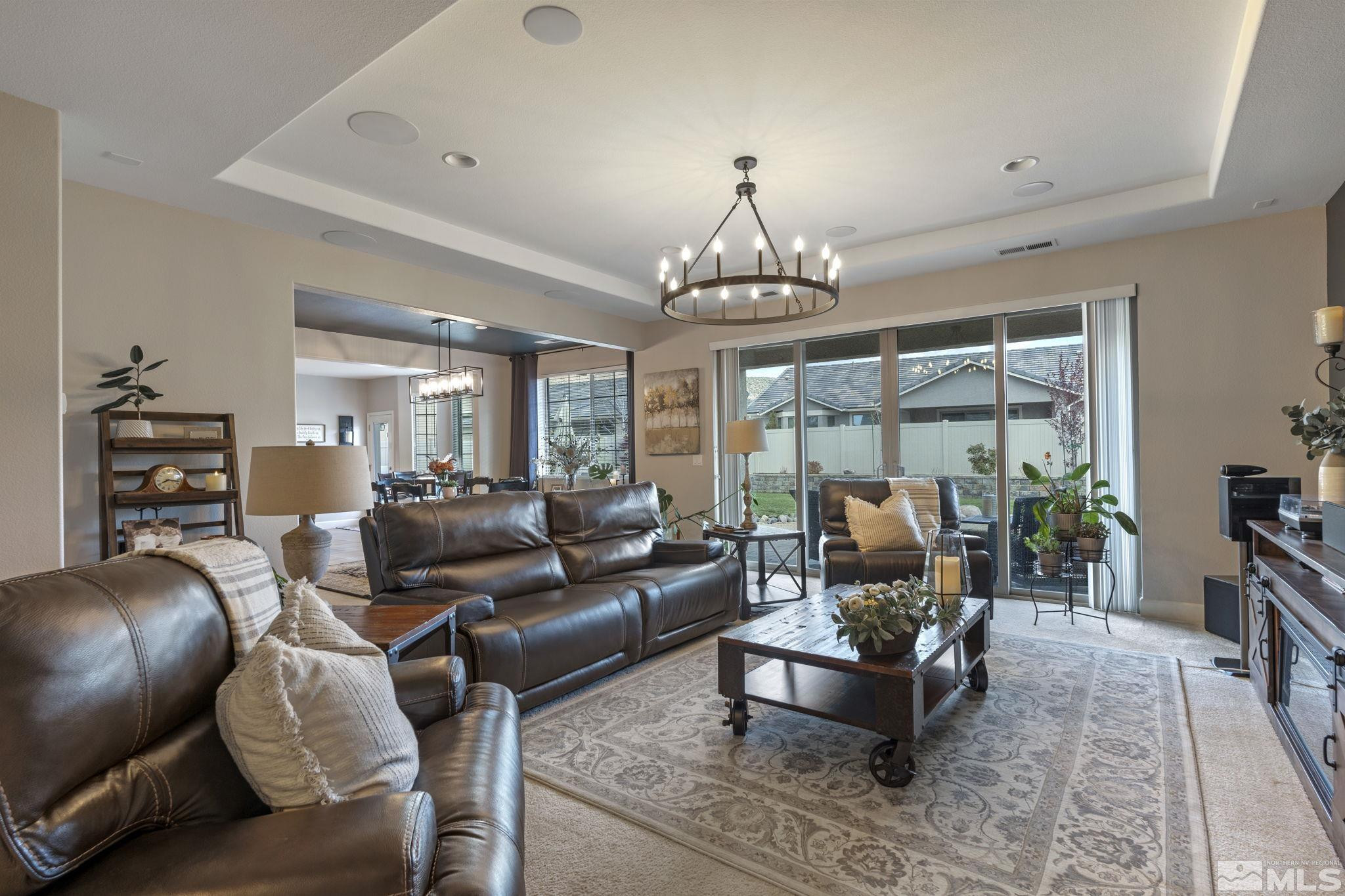508 Alpine Rose Ct. Reno, NV 89521 - Photo 7 of 39 a living room with furniture and a chandelier
