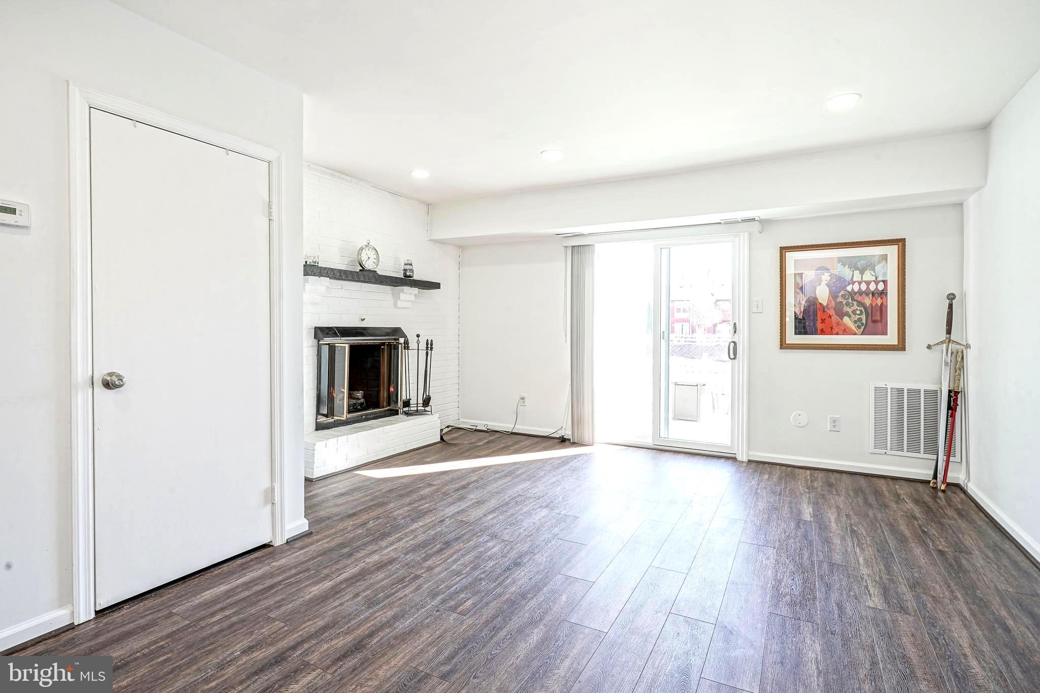 5 Via Cascata Drive Clementon, NJ 08021 - Photo 9 of 26 an empty room with wooden floor fireplace and windows