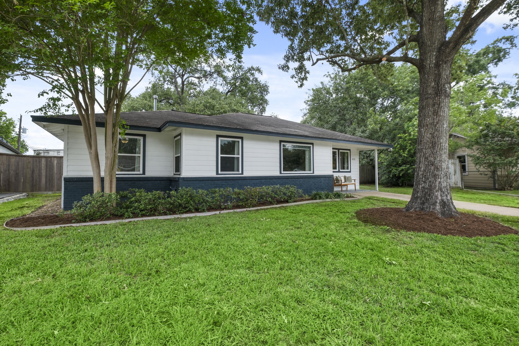 4733 Carleen Road Houston, TX 77092 - Photo 2 of 22 Mature trees and refreshed landscaping create standout curb appeal on this oversized Oak Forest lot.