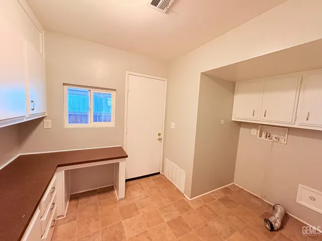 a room that has a bed and a window in it