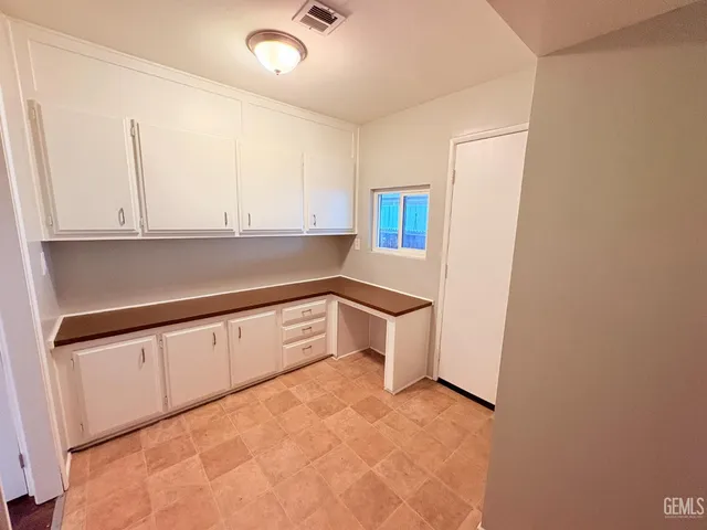 a view of cabinets and window