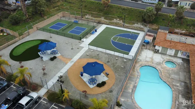 an aerial view of a house with a swimming pool