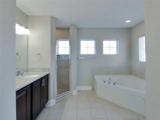 a bathroom with a bathtub and a sink