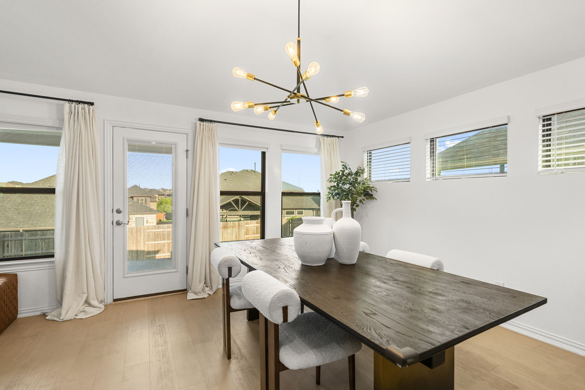 463 Oleander Loop Buda, TX 78610 - Photo 11 of 34 a view of a dining room with furniture window and wooden floor