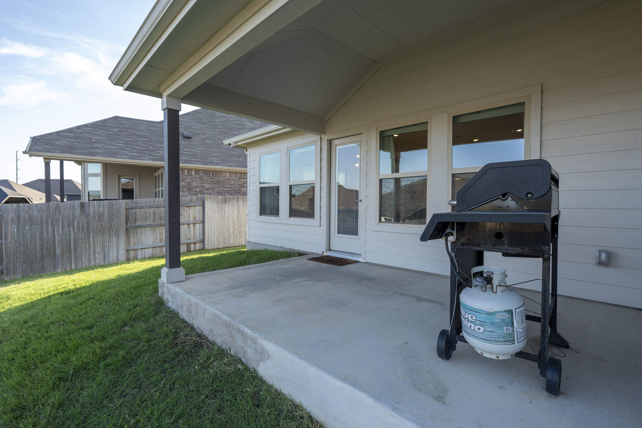 463 Oleander Loop Buda, TX 78610 - Photo 19 of 34 a backyard of a house with barbeque oven table and chairs