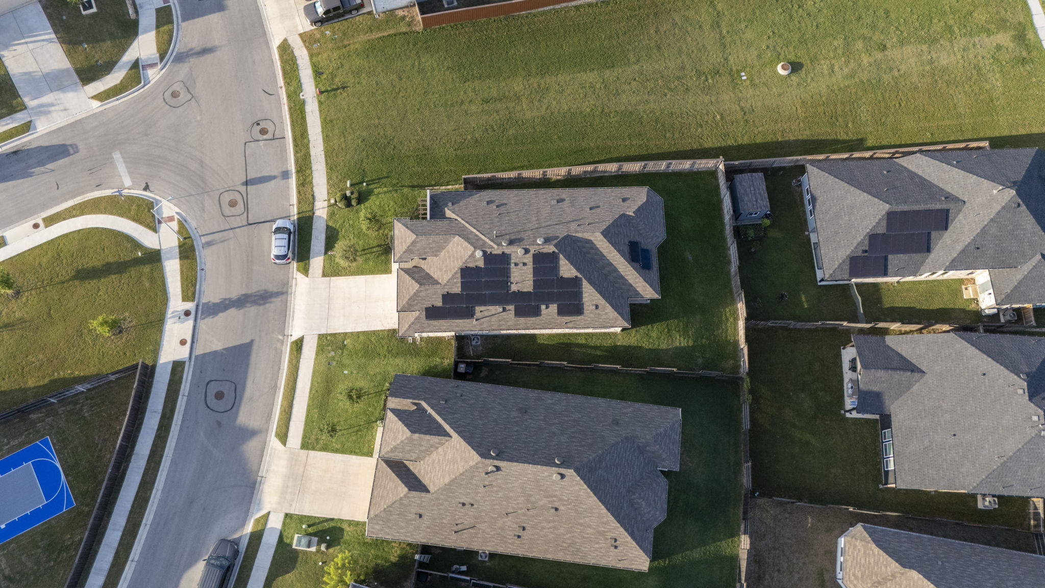 463 Oleander Loop Buda, TX 78610 - Photo 20 of 34 an aerial view of a house with a yard pool a patio and outdoor seating