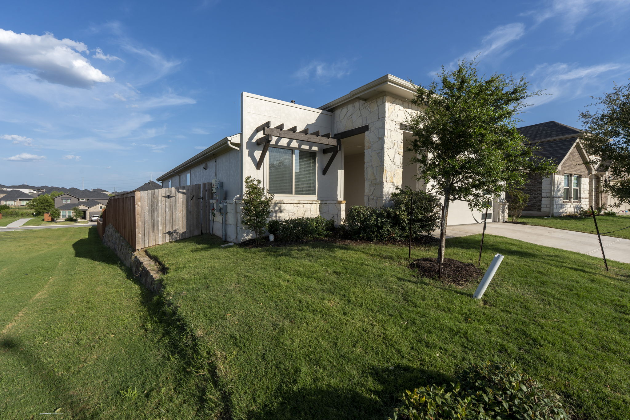 463 Oleander Loop Buda, TX 78610 - Photo 26 of 34 a front view of a house with garden