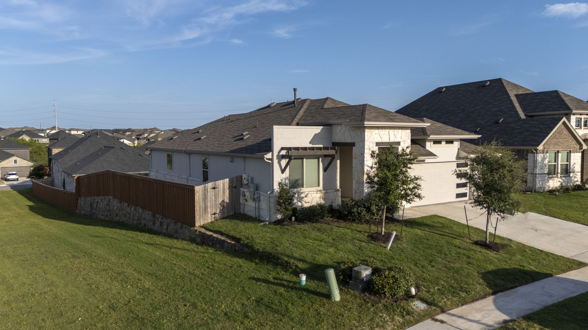 463 Oleander Loop Buda, TX 78610 - Photo 27 of 34 a front view of a house with garden