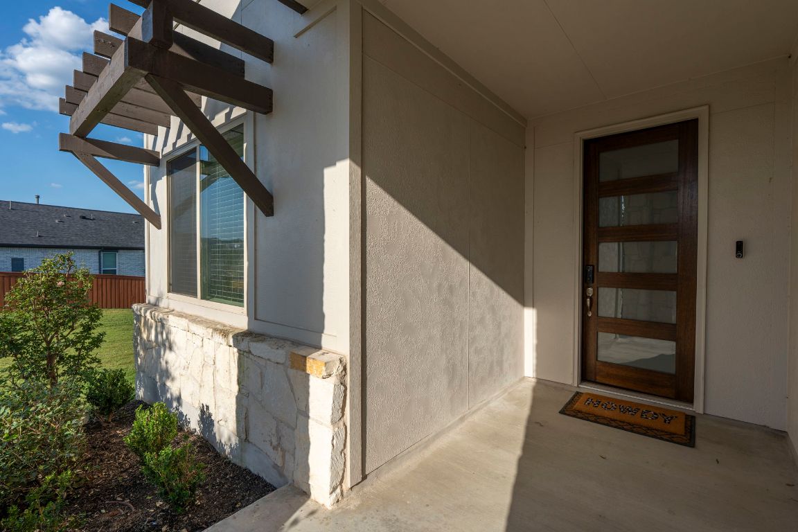463 Oleander Loop Buda, TX 78610 - Photo 28 of 34 View of exterior entry with stucco siding