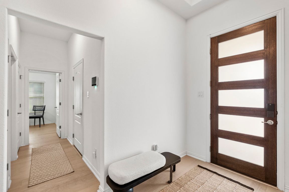 463 Oleander Loop Buda, TX 78610 - Photo 3 of 34 Foyer entrance featuring light wood-style flooring