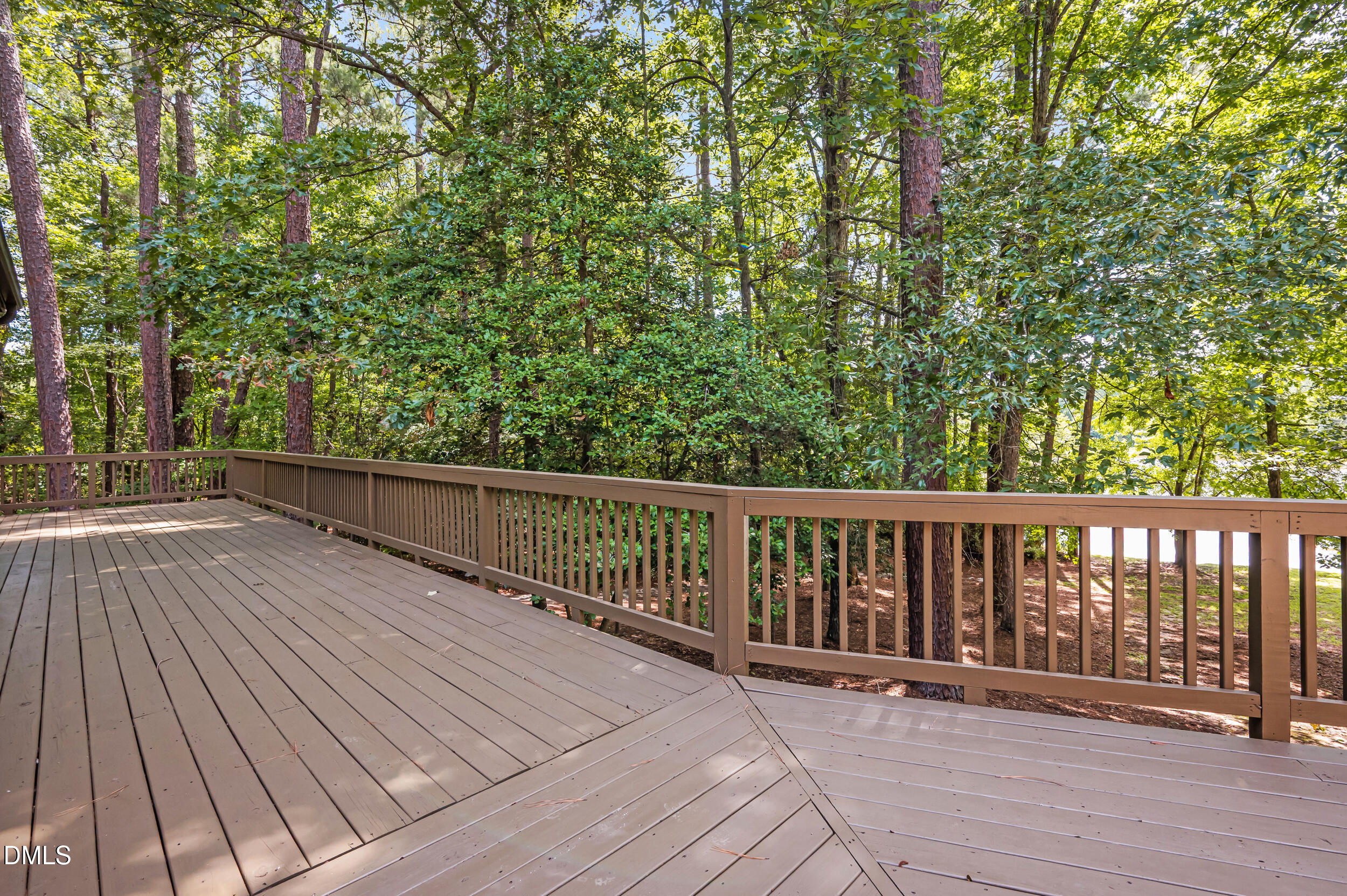1621 Pearces Road Zebulon, NC 27597 - Photo 60 of 82 Deck going toward primary bedroom