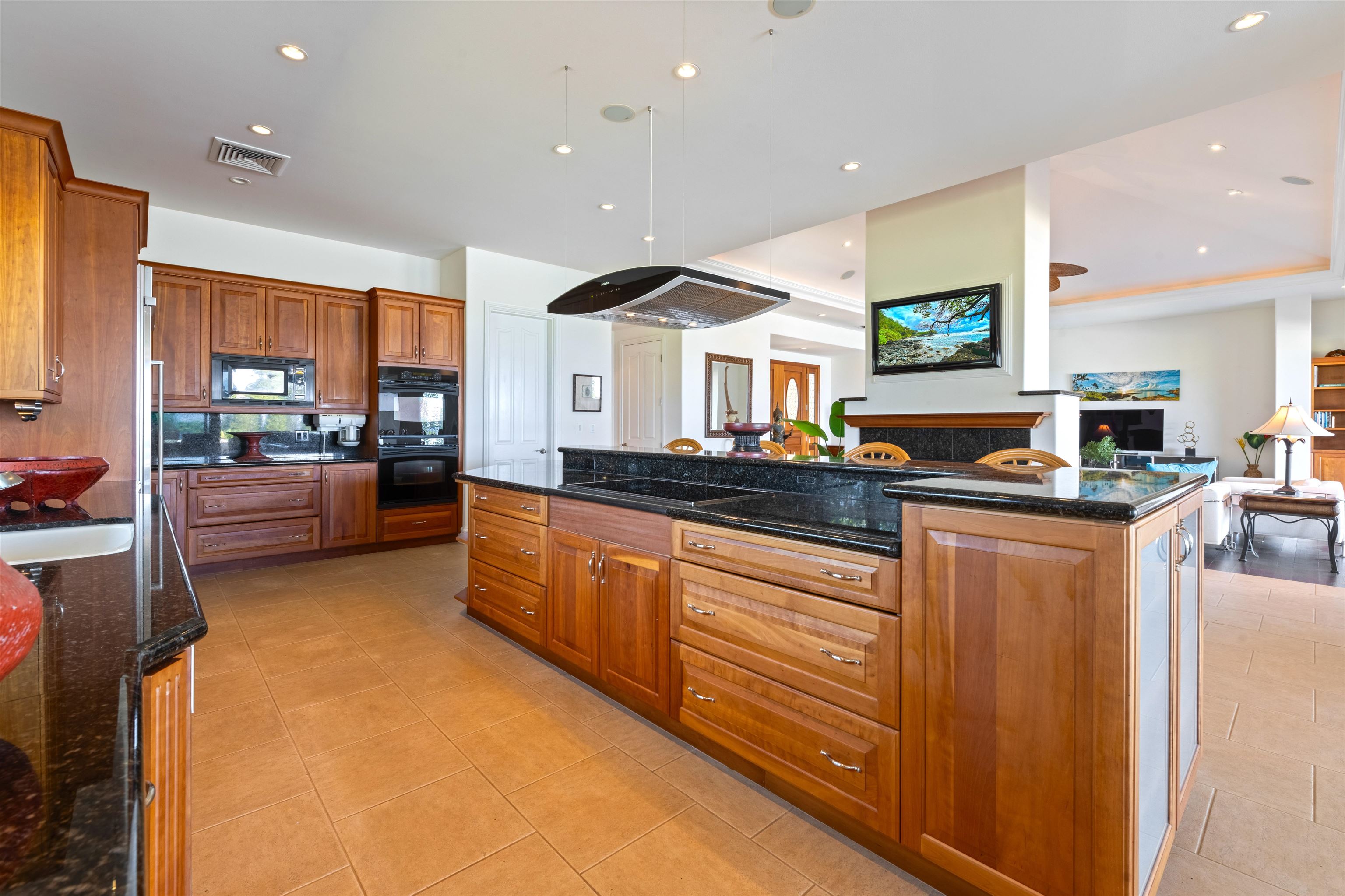 232 Crestview Road Lahaina, HI 96761 - Photo 11 of 45 a kitchen with stainless steel appliances granite countertop a sink and cabinets