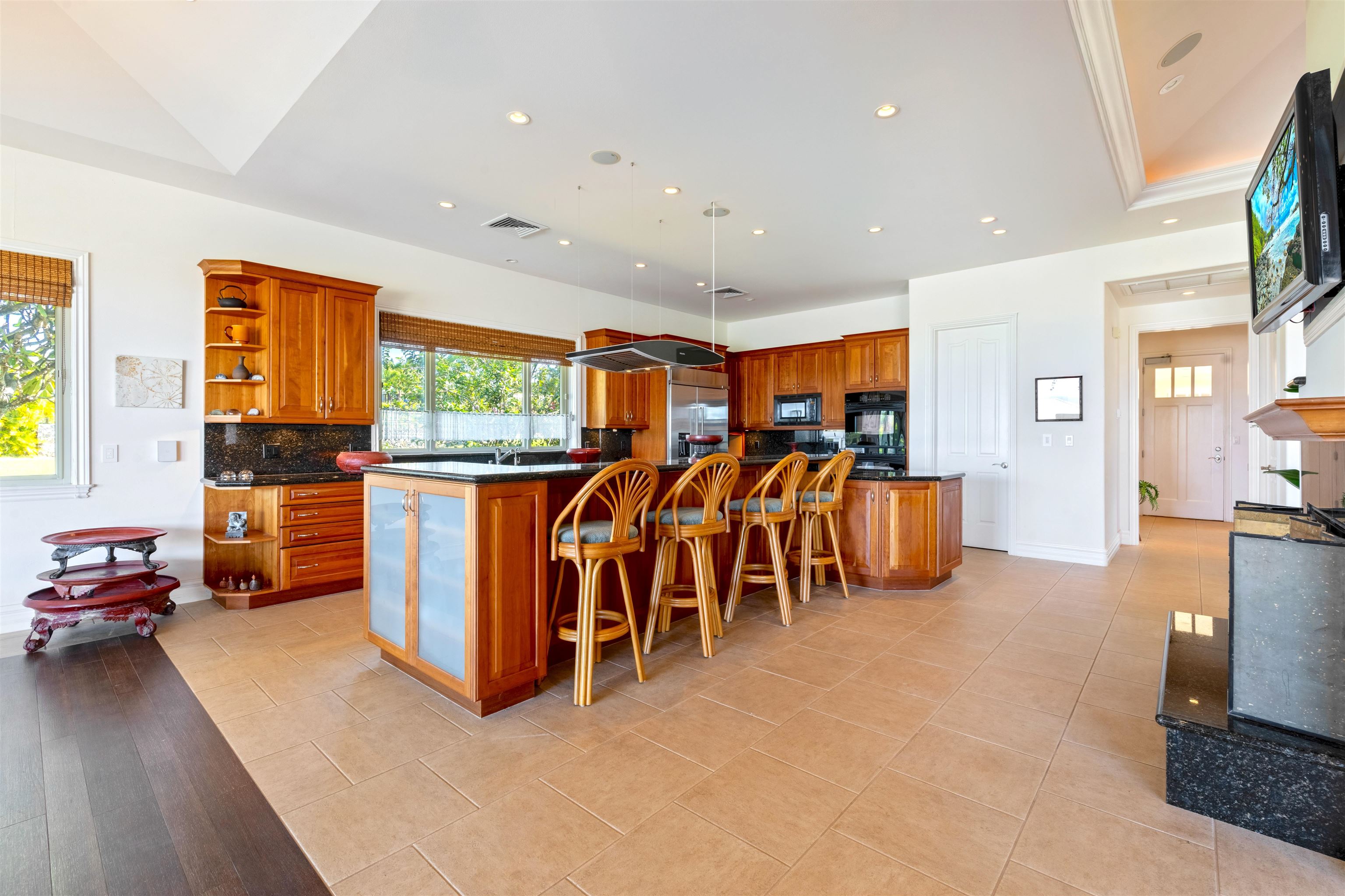 232 Crestview Road Lahaina, HI 96761 - Photo 13 of 45 a living room with furniture a flat screen tv and next to a window