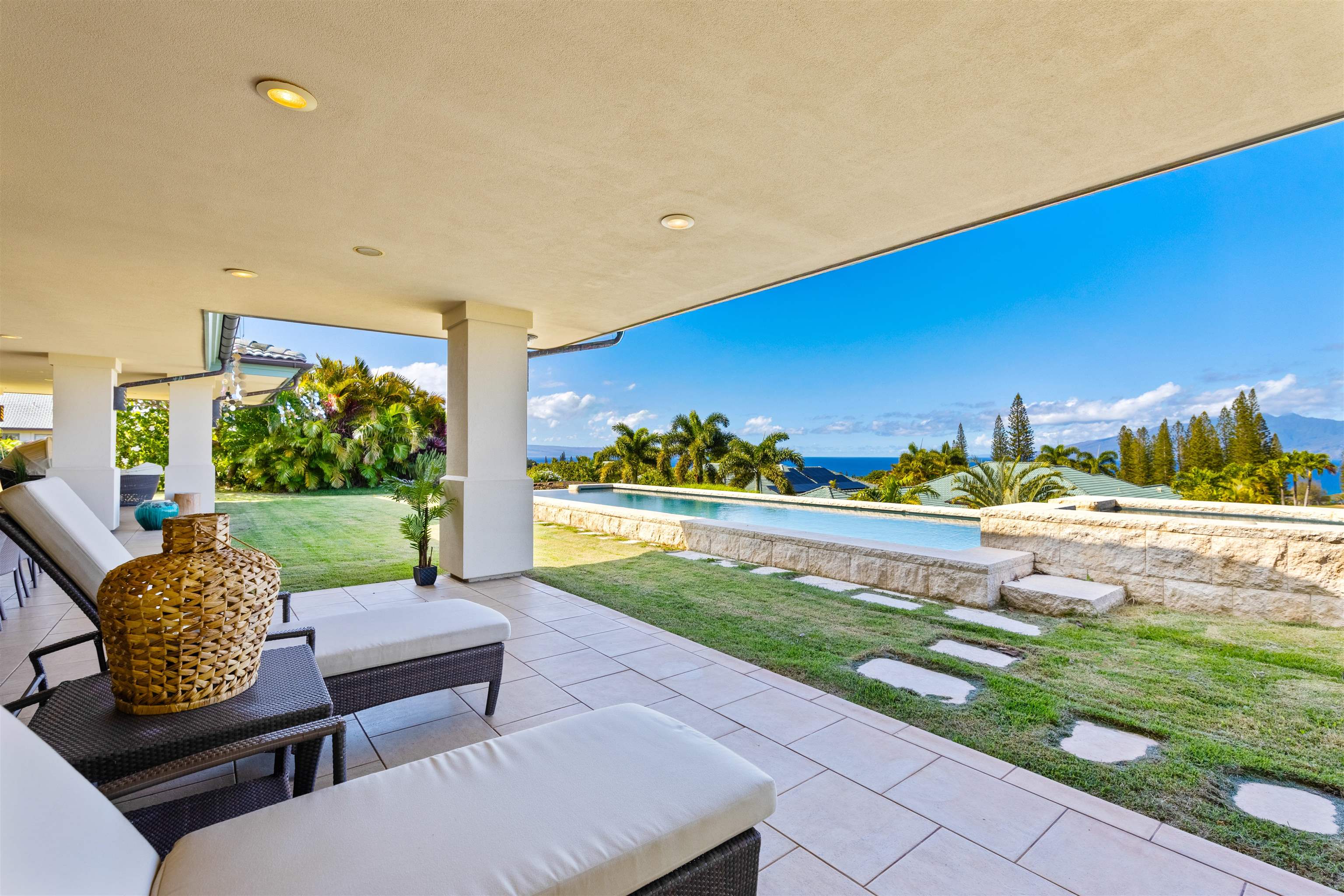 232 Crestview Road Lahaina, HI 96761 - Photo 15 of 45 a view of a patio with couches table and chairs with potted plants