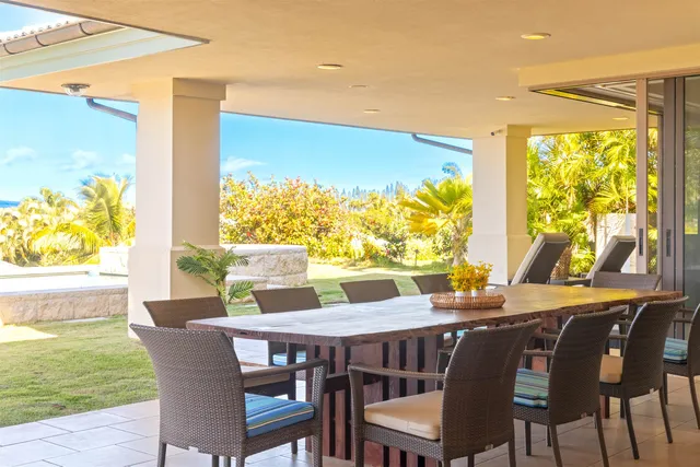 a view of an outdoor dining space with furniture