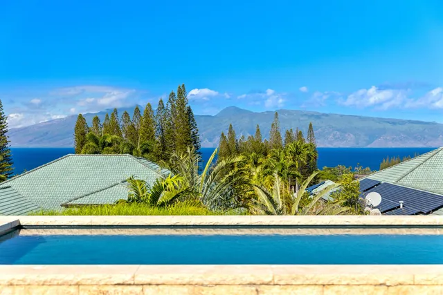a view of a swimming pool with an outdoor space and seating area