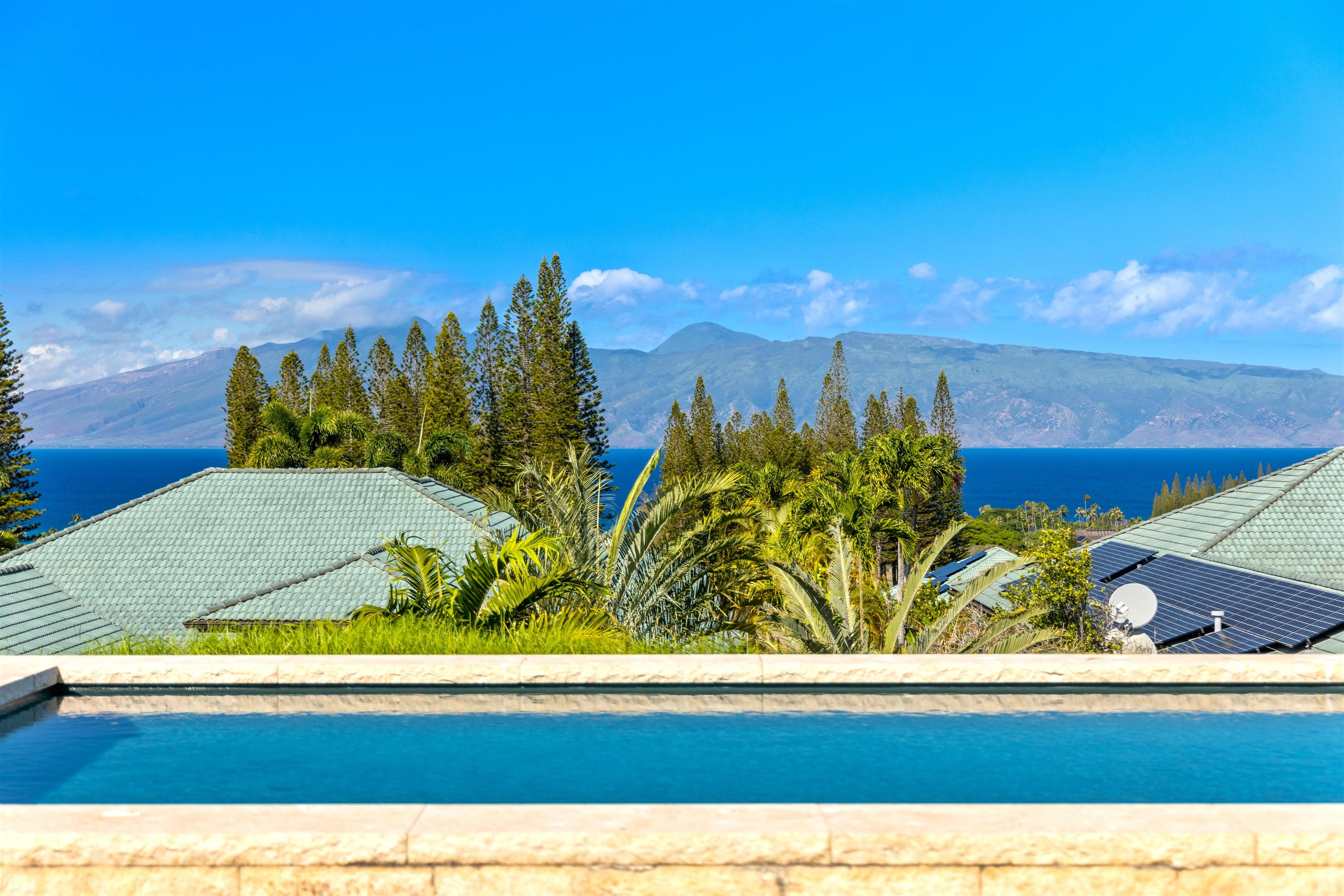 232 Crestview Road Lahaina, HI 96761 - Photo 19 of 45 a view of a swimming pool with an outdoor space and seating area