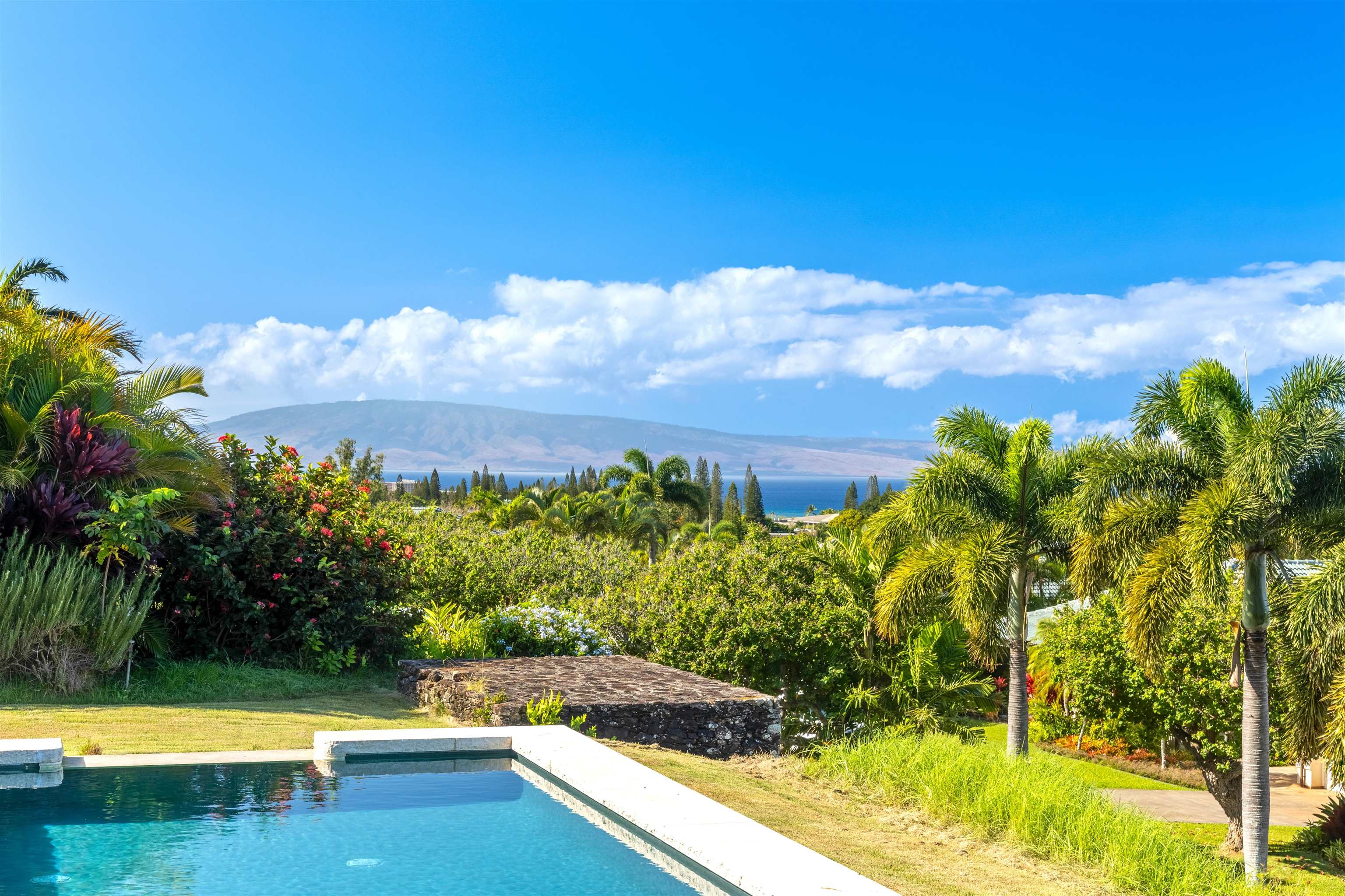 232 Crestview Road Lahaina, HI 96761 - Photo 21 of 45 a view of a swimming pool with an outdoor seating and a yard