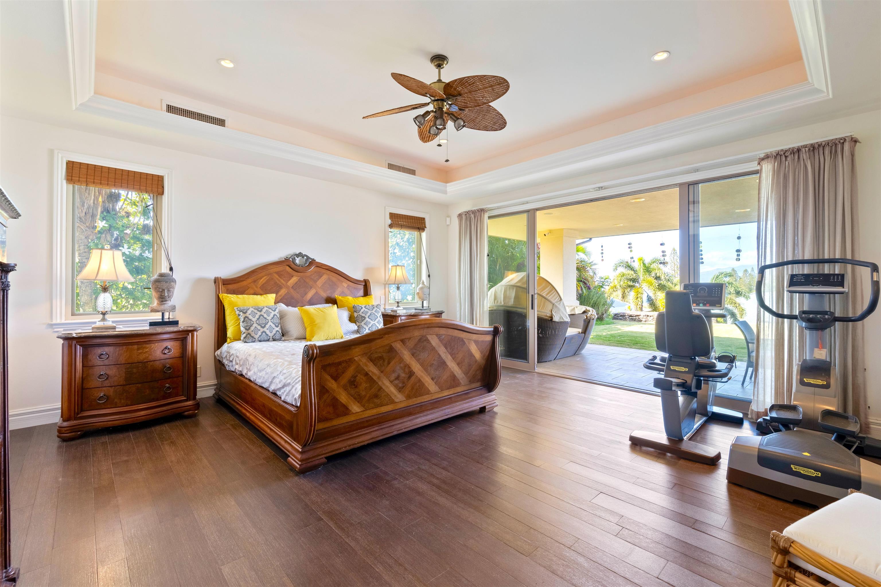 232 Crestview Road Lahaina, HI 96761 - Photo 23 of 45 a bedroom with a bed and wooden floor