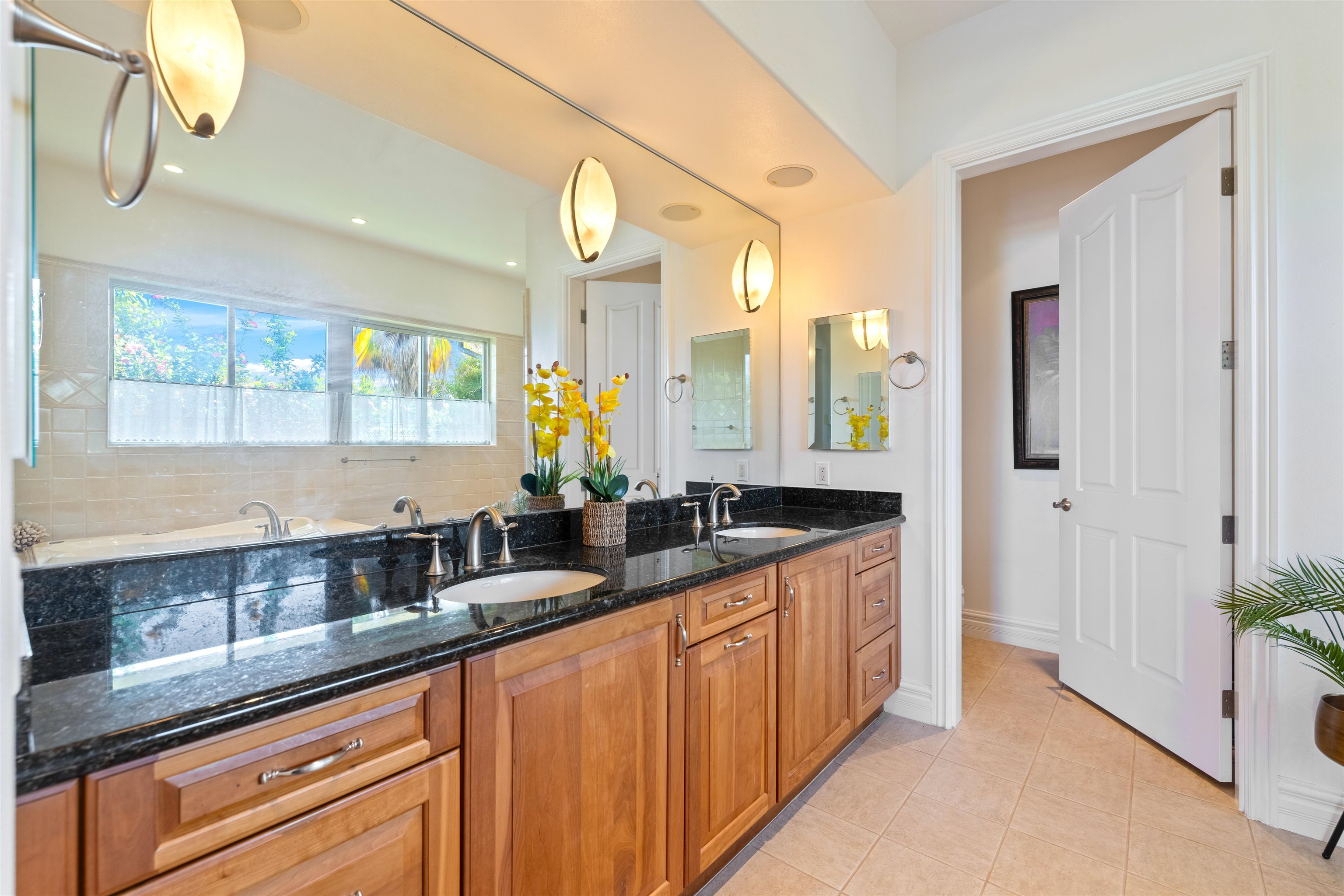 232 Crestview Road Lahaina, HI 96761 - Photo 28 of 45 a kitchen with granite countertop stainless steel appliances a sink and cabinets