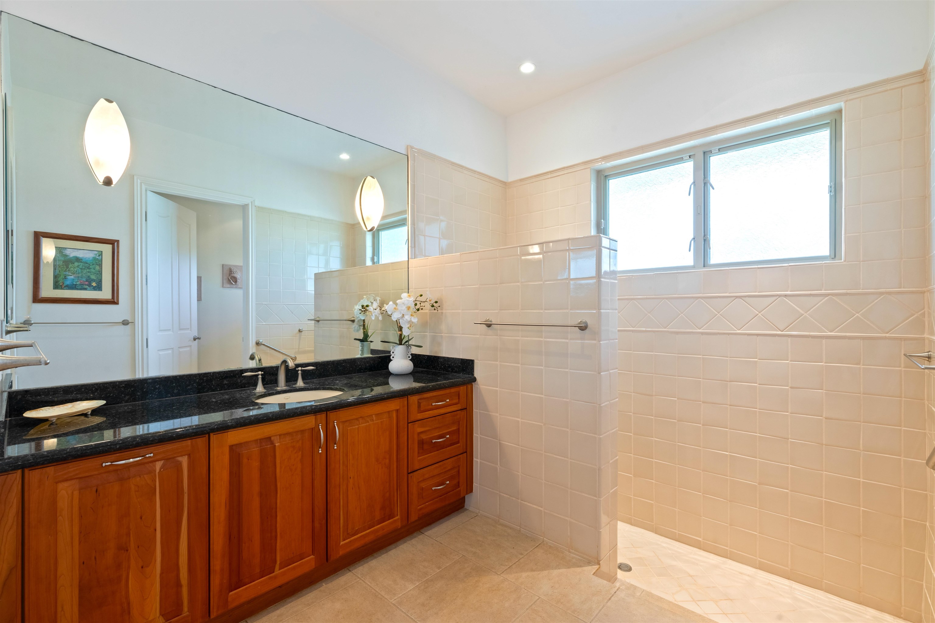 232 Crestview Road Lahaina, HI 96761 - Photo 38 of 45 a bathroom with a granite countertop sink and a mirror