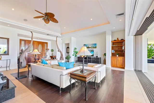 a living room with fireplace furniture and a wooden floor