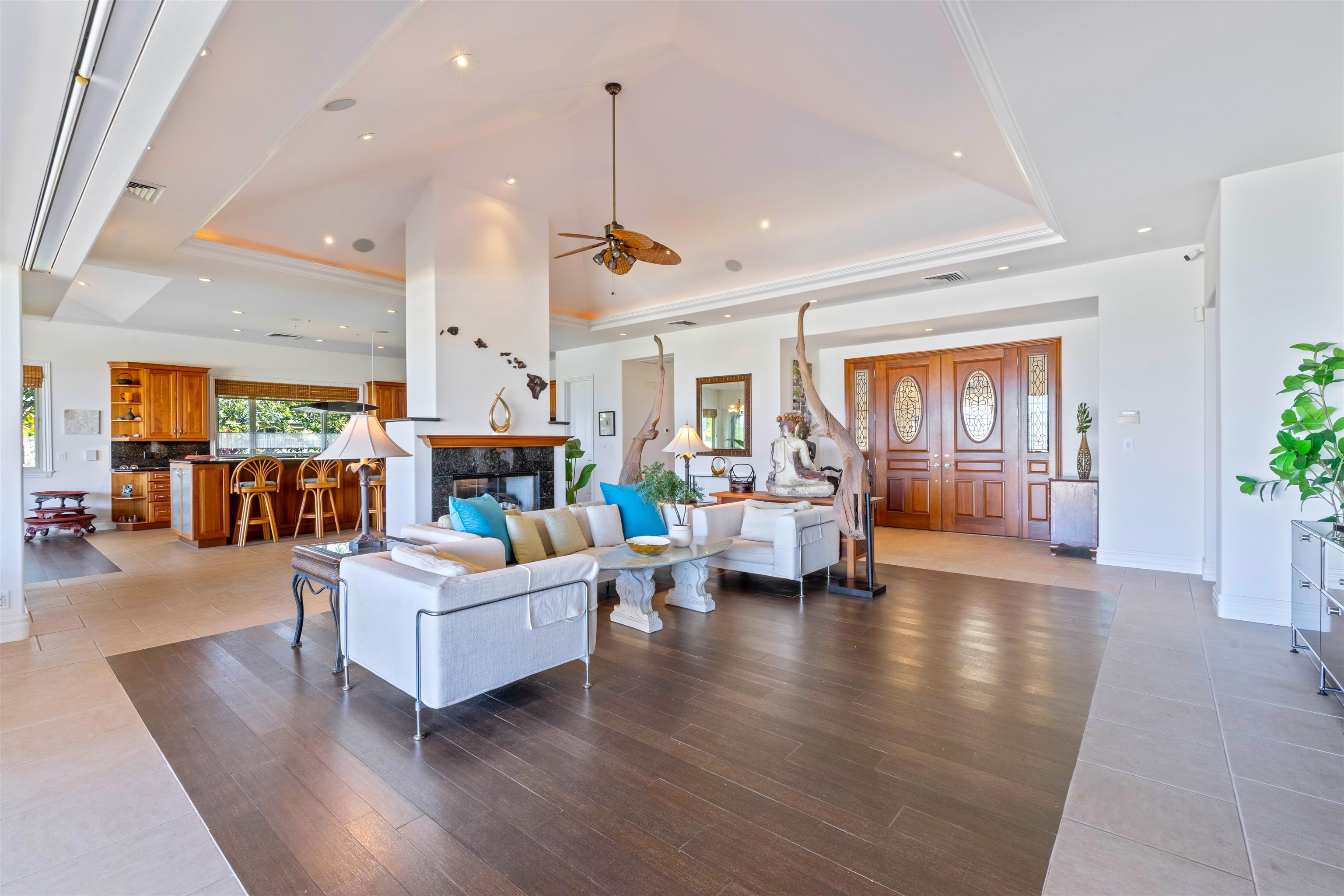 232 Crestview Road Lahaina, HI 96761 - Photo 6 of 45 a living room with fireplace furniture and a wooden floor