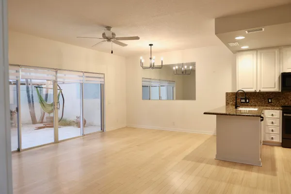 a view of a kitchen with a sink and a window