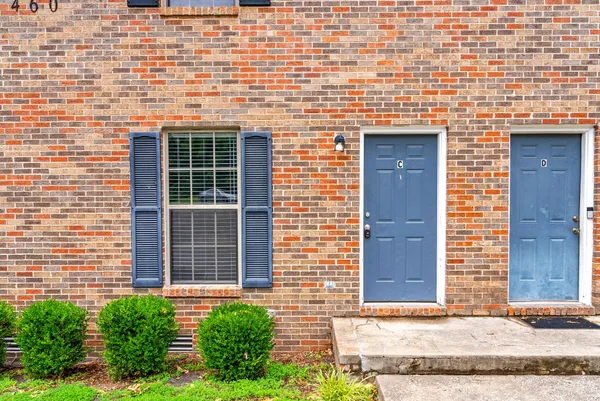 view of a brick house with a street