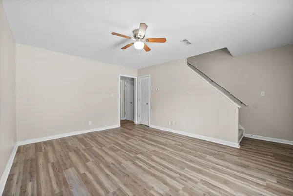 a kitchen with stainless steel appliances granite countertop a refrigerator a stove a sink and a microwave