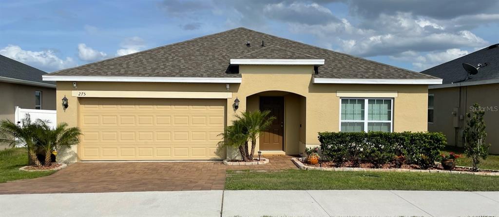 275 Sparrow Hawk Drive Groveland, FL 34736 - Photo 1 of 1 a front view of a house with a yard