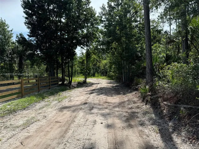 a view of outdoor space with deck and yard