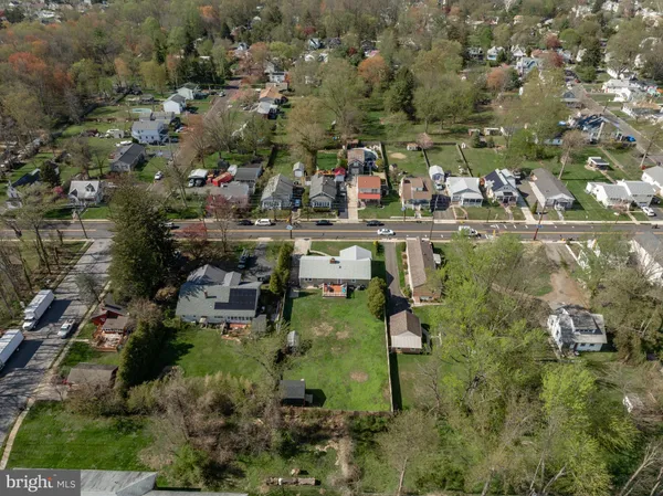 a aerial view of a house with swimming pool and a yard