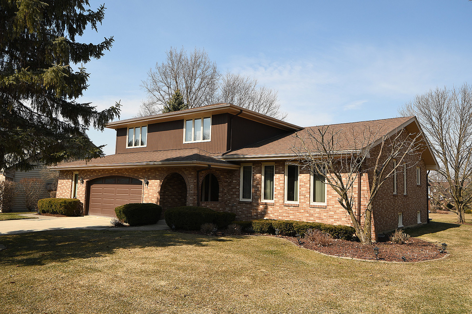 15 87th Street Burr Ridge, IL 60527 - Photo 1 of 34 a front view of a house with a yard