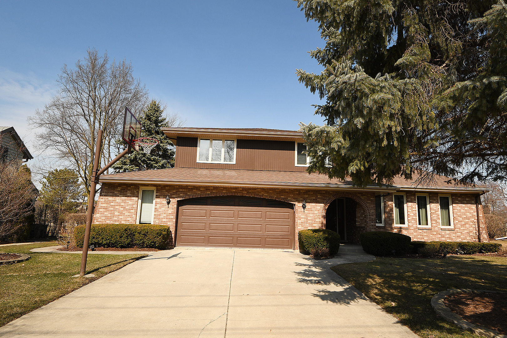 15 87th Street Burr Ridge, IL 60527 - Photo 2 of 34 a front view of a house with a yard