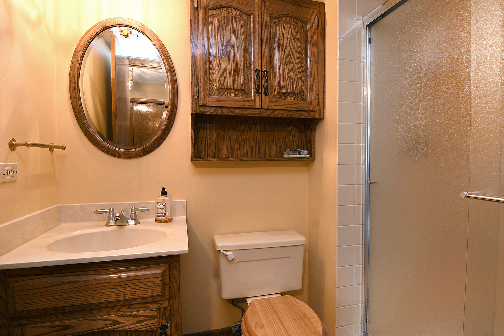 15 87th Street Burr Ridge, IL 60527 - Photo 19 of 34 a bathroom with a sink and a mirror