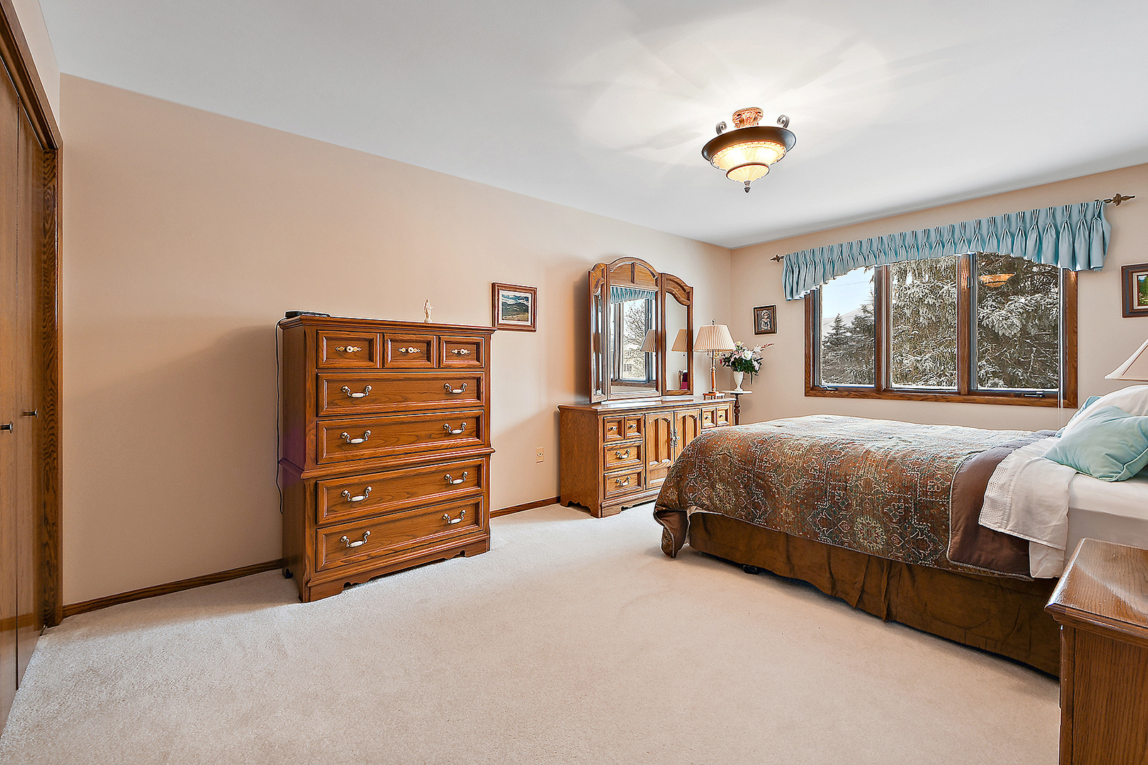 15 87th Street Burr Ridge, IL 60527 - Photo 26 of 34 a bedroom with a bed and a painting on the wall