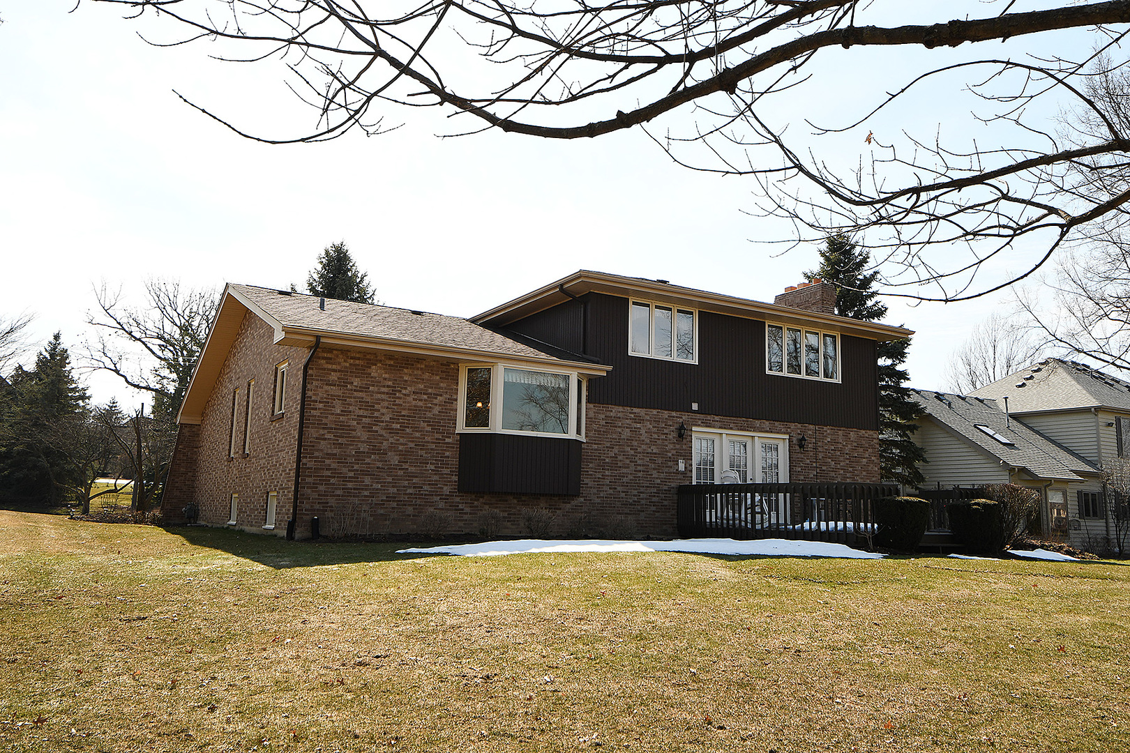 15 87th Street Burr Ridge, IL 60527 - Photo 32 of 34 a house that has a tree in front of it