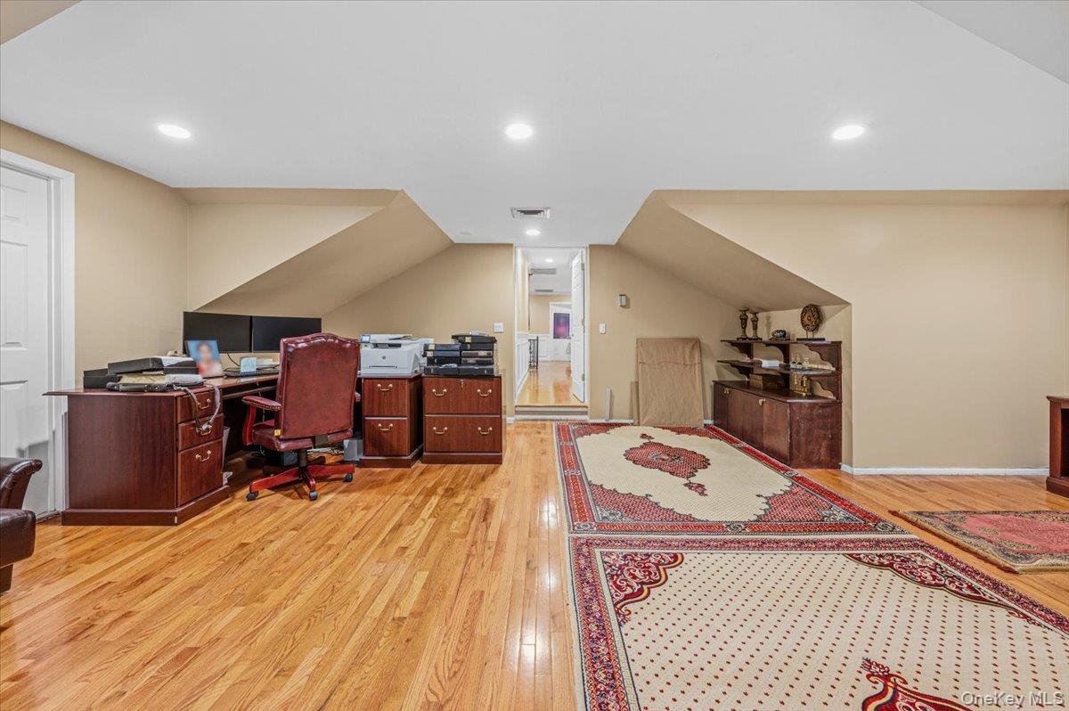 626 Caledonia Road Dix Hills, NY 11746 - Photo 25 of 49 a bed room with a bed and furniture