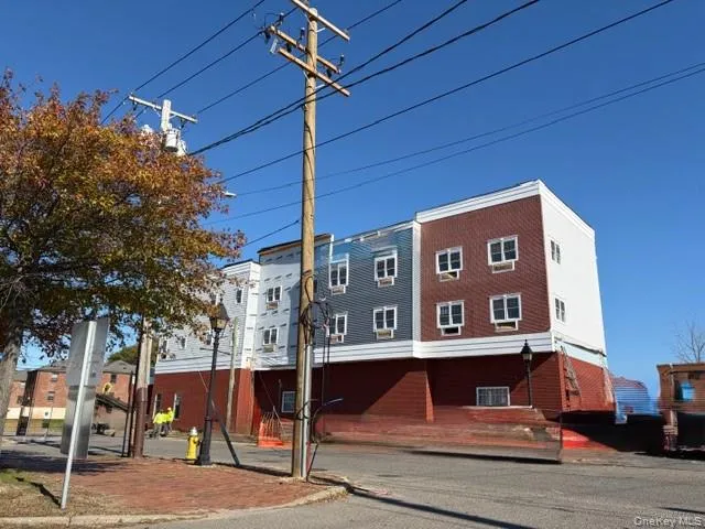 a front view of a building with street view